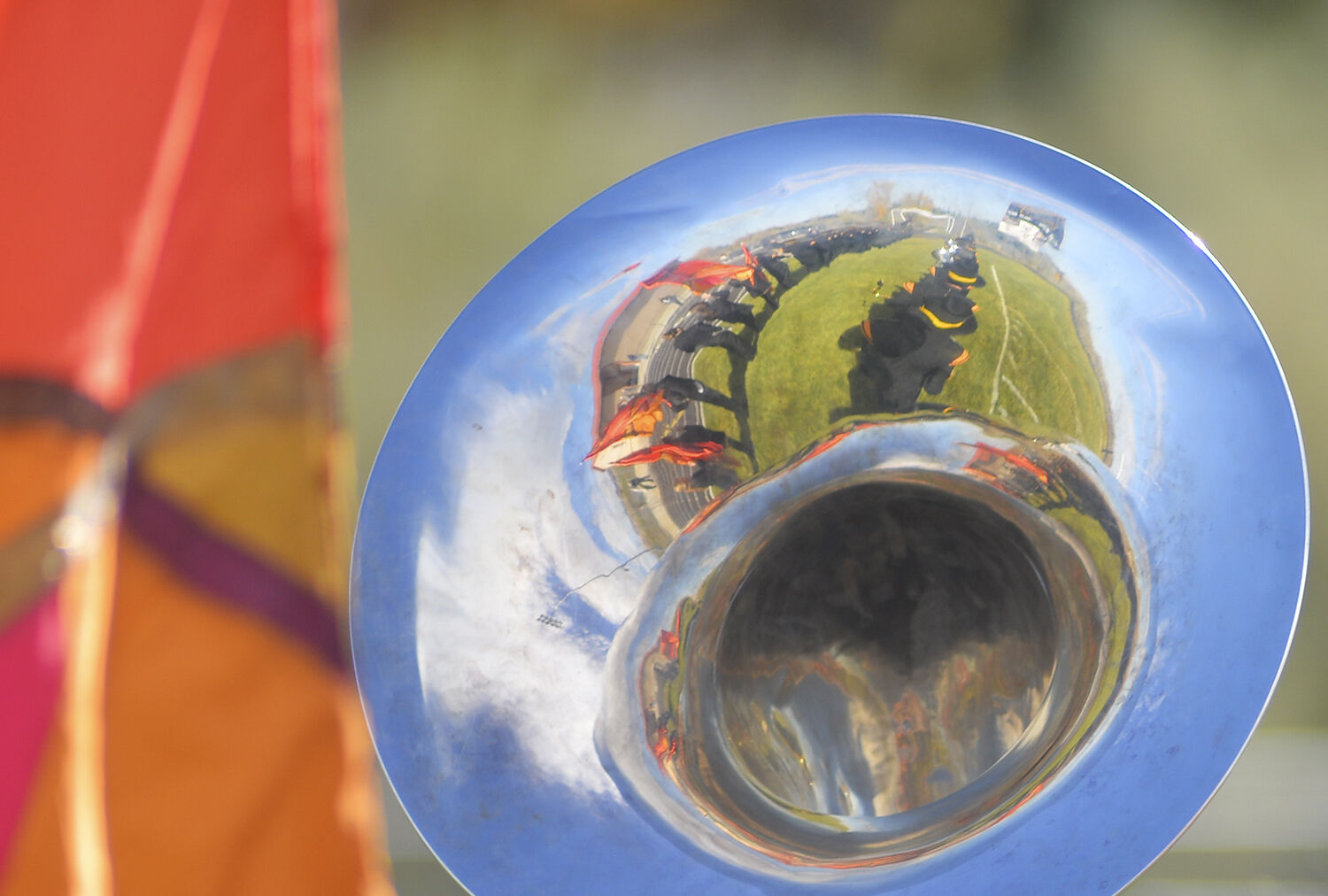 The band and color guard are reflected in the bells